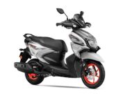 Yamaha scooter with silver body, black seat, and bright red rims, showcasing a compact sporty design and modern styling attributes